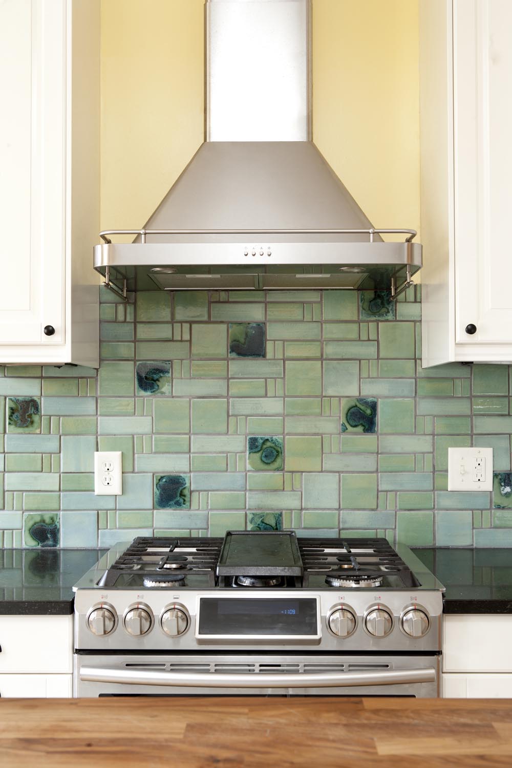 Aquilla kicken backsplash in Copper Patina and Wasabi with Aandromeda Cosmic Cloud accents